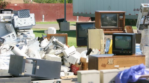 Professional team removing bulky furniture for disposal
